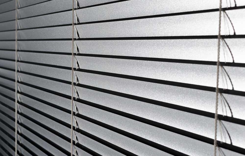 WhatsApp Image 2026-04-07 at 15.18.34 Aluminum Venetian blinds in Perth with sleek horizontal slats controlling sunlight in a contemporary interior setting