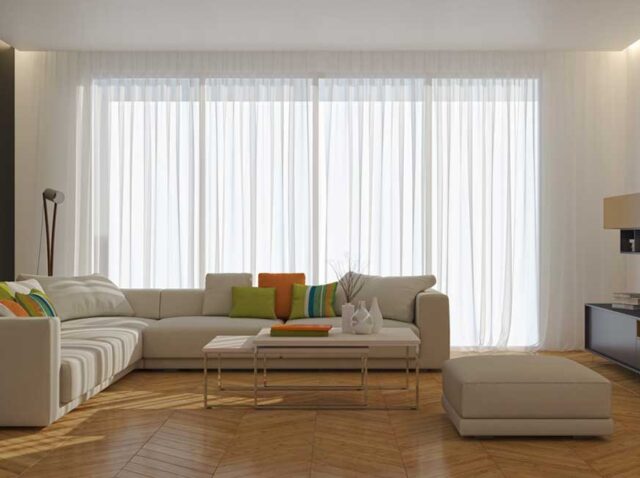 Why More Homeowners Are Choosing Motorised Sheer Curtains Modern living room featuring motorised sheer curtains with smart light control and elegant interior design