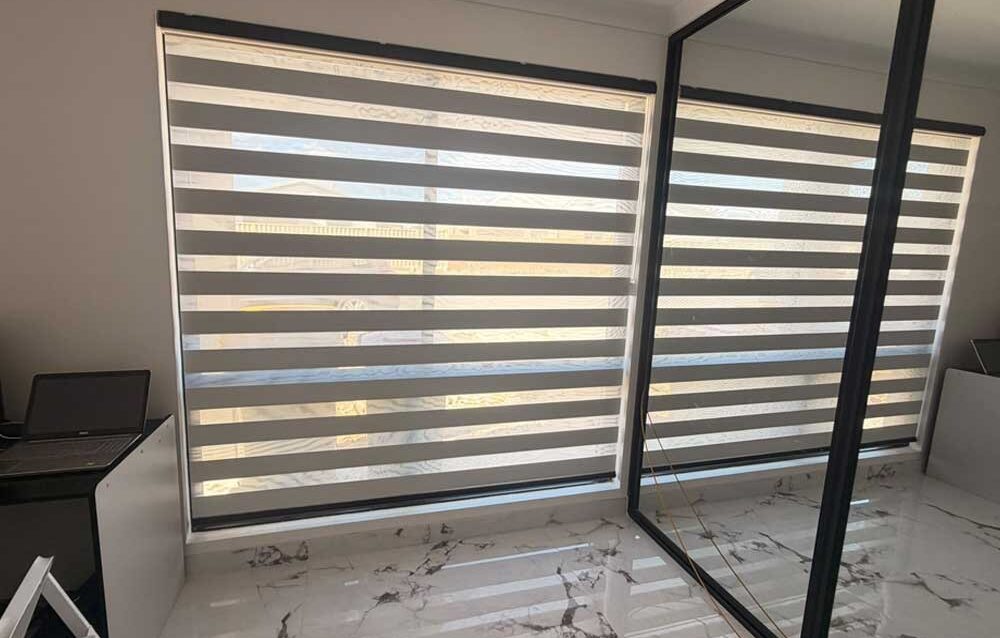 Zebra Blinds Privacy Guide Modern zebra blinds providing privacy while allowing natural light into a contemporary living room